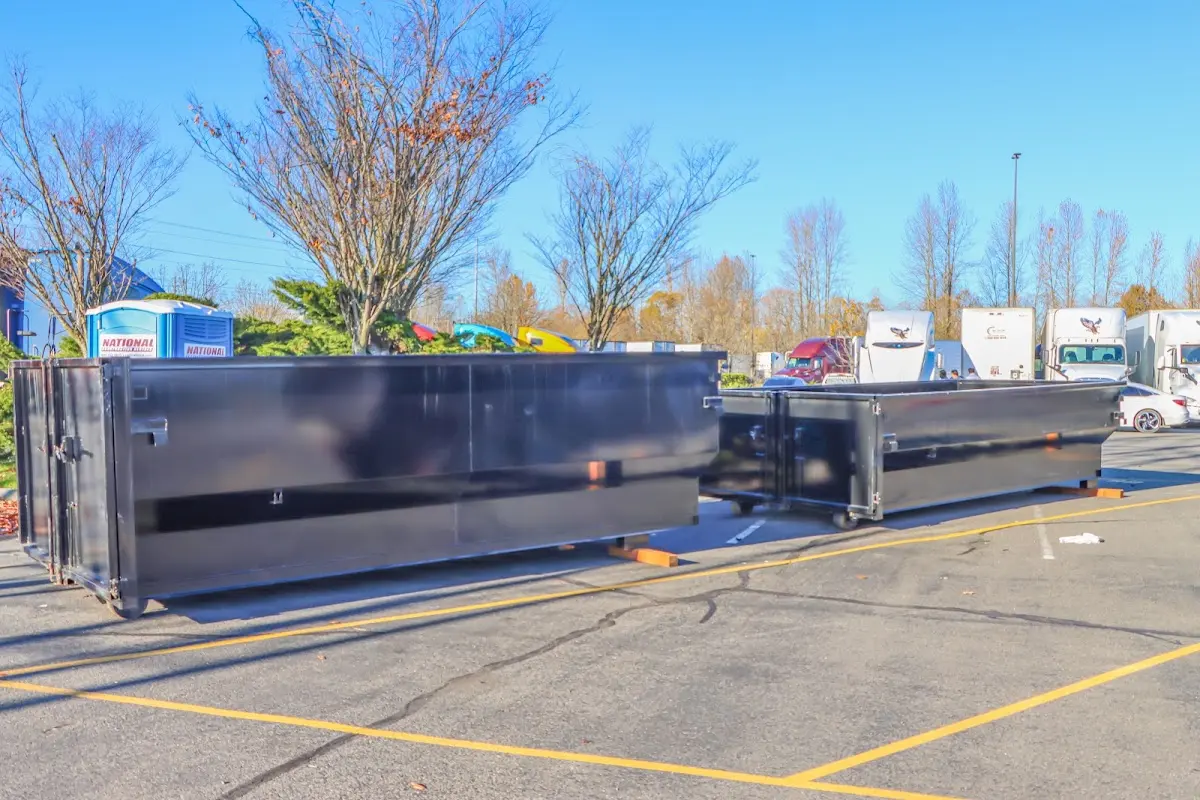 Professional dumpster rental service with roll-off container on residential driveway in Valrico